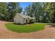 Well-maintained lawn surrounding a charming single-story home with dark trim windows at Lot 2 Harmony Rd, Temple, GA 30179