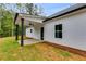 Exterior detail of a home with a cozy, covered patio perfect for enjoying the outdoors at Lot 2 Harmony Rd, Temple, GA 30179