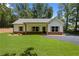 Beautiful single-story home with a well-manicured lawn, dark trim windows, and a welcoming front porch at Lot 2 Harmony Rd, Temple, GA 30179