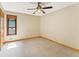 Carpeted bedroom with a ceiling fan and natural light from a window at 137 Trickum Hills Dr, Woodstock, GA 30188