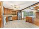 Modern kitchen with stainless steel appliances, an island, and beautiful floors adjoins the dining area at 137 Trickum Hills Dr, Woodstock, GA 30188