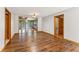 Open living area featuring wood flooring, with easy access to the dining area and a glimpse of stairs at 137 Trickum Hills Dr, Woodstock, GA 30188