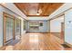 Living room featuring hardwood floors, wood ceiling, recessed lights, and window views at 137 Trickum Hills Dr, Woodstock, GA 30188