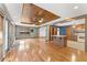 Open concept living room with hardwood floors, wood ceiling, recessed lights, and breakfast bar at 137 Trickum Hills Dr, Woodstock, GA 30188