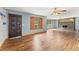 Inviting living room with wood floors and fireplace, illuminated by natural light from large windows at 137 Trickum Hills Dr, Woodstock, GA 30188