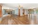 Open living room boasts wood floors, brick fireplace, and abundant natural light with view to the deck at 137 Trickum Hills Dr, Woodstock, GA 30188