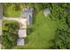 Aerial view of a traditional home with multiple outbuildings, surrounded by lush greenery at 2333 Old Newnan Rd, Carrollton, GA 30116