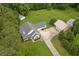 Expansive aerial showcasing the traditional home, additional buildings, and surrounding lush greenery at 2333 Old Newnan Rd, Carrollton, GA 30116
