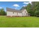 Expansive backyard featuring a well-maintained lawn and exterior view of the residence at 2333 Old Newnan Rd, Carrollton, GA 30116