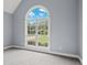 Bedroom featuring vaulted ceiling and a large window with a backyard view at 2333 Old Newnan Rd, Carrollton, GA 30116