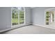 Bedroom with carpet, large windows providing lots of natural light at 2333 Old Newnan Rd, Carrollton, GA 30116