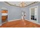 This dining room has an open floor plan with hardwood floors and an arched entrance at 2333 Old Newnan Rd, Carrollton, GA 30116