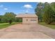 Detached garage with a carport and large parking pad at 2333 Old Newnan Rd, Carrollton, GA 30116