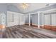 A spacious living room with vaulted ceilings, columns, and built-in bookshelves at 2333 Old Newnan Rd, Carrollton, GA 30116