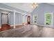 A spacious living room with vaulted ceilings, columns, and abundant natural light at 2333 Old Newnan Rd, Carrollton, GA 30116