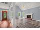 A spacious living room with vaulted ceilings, fireplace, and abundant natural light at 2333 Old Newnan Rd, Carrollton, GA 30116
