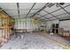 Interior of storage shed with gravel floor, shelving, and supplies at 2333 Old Newnan Rd, Carrollton, GA 30116