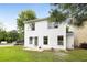 View of the home's backyard, featuring a well-maintained lawn and mature trees at 3063 Broadleaf Trl, Fairburn, GA 30213