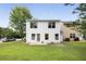 Picture of a white-sided two story home with a small concrete backyard patio at 3063 Broadleaf Trl, Fairburn, GA 30213