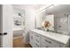 Bright bathroom featuring double sinks with marble countertop and a view of the bedroom at 3063 Broadleaf Trl, Fairburn, GA 30213