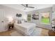 Bright bedroom with plush bed, ceiling fan, and natural light from the large windows at 3063 Broadleaf Trl, Fairburn, GA 30213
