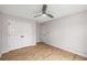 Clean bedroom with wood-look floors and a ceiling fan with ample space and natural light at 3063 Broadleaf Trl, Fairburn, GA 30213