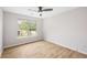 Bright, minimal bedroom with a view from the window and modern flooring at 3063 Broadleaf Trl, Fairburn, GA 30213