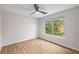 Bright, minimal bedroom with a large window and modern flooring at 3063 Broadleaf Trl, Fairburn, GA 30213
