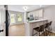 Bright, airy kitchen features modern appliances, bar-style seating, and ample cabinet space at 3063 Broadleaf Trl, Fairburn, GA 30213