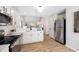 Kitchen with stainless steel appliances and view to living space at 3063 Broadleaf Trl, Fairburn, GA 30213