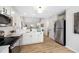 Stylish kitchen boasts stainless steel appliances and modern countertops at 3063 Broadleaf Trl, Fairburn, GA 30213