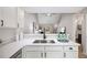 Modern kitchen with stainless appliances, quartz countertops and a view to living area at 3063 Broadleaf Trl, Fairburn, GA 30213