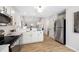 Stainless appliances, white cabinets and quartz countertops in this kitchen at 3063 Broadleaf Trl, Fairburn, GA 30213