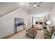 Open-concept living area boasts high ceilings, seamless access to the kitchen, and bright, neutral decor at 3063 Broadleaf Trl, Fairburn, GA 30213