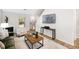 Comfortable living room featuring a fireplace and modern decor at 3063 Broadleaf Trl, Fairburn, GA 30213