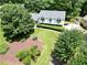 Aerial view showcases the home's landscaping, mature trees, and well-manicured lawn, highlighting curb appeal at 3107 Bunker Hill Cir, Marietta, GA 30062