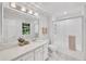 Bright bathroom with a double vanity, shower and marble countertop at 3107 Bunker Hill Cir, Marietta, GA 30062