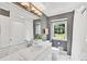Bright bathroom with a double vanity, shower and marble countertop at 3107 Bunker Hill Cir, Marietta, GA 30062