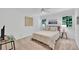 Bright bedroom with neutral tones, large windows, and ceiling fan create a peaceful and relaxing atmosphere at 3107 Bunker Hill Cir, Marietta, GA 30062