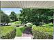 Manicured front yard featuring lush lawn, mature trees, and neatly trimmed hedges framing the property at 3107 Bunker Hill Cir, Marietta, GA 30062
