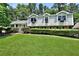 Charming two-story home with manicured lawn and lush landscaping, offering curb appeal at 3107 Bunker Hill Cir, Marietta, GA 30062