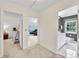 Hallway with access to bedrooms and a gray tiled bathroom at 3107 Bunker Hill Cir, Marietta, GA 30062