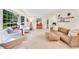 Bright living room with neutral paint, plush carpeting, and ample seating, perfect for relaxation at 3107 Bunker Hill Cir, Marietta, GA 30062