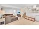 Relaxing living room with stairs to the kitchen and neutral decor at 3107 Bunker Hill Cir, Marietta, GA 30062