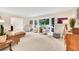Spacious living room with plush carpeting, a large bay window, and comfortable seating at 3107 Bunker Hill Cir, Marietta, GA 30062
