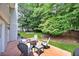 Outdoor patio space with a fire pit surrounded by comfortable seating, perfect for entertaining guests at 3107 Bunker Hill Cir, Marietta, GA 30062