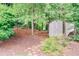 Outdoor shed in a wooded area provides extra storage space and complements the natural landscape at 3107 Bunker Hill Cir, Marietta, GA 30062