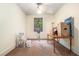 Bedroom with tan carpet, a window, ceiling fan, and off-white walls at 5317 Highway 81, Loganville, GA 30052