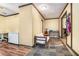 Hallway featuring durable flooring and access to a spare freezer; versatile space for extra storage and functionality at 5317 Highway 81, Loganville, GA 30052