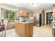 Well-lit kitchen boasting ample cabinetry, stainless steel appliances, and a center island for efficient meal preparation at 5317 Highway 81, Loganville, GA 30052